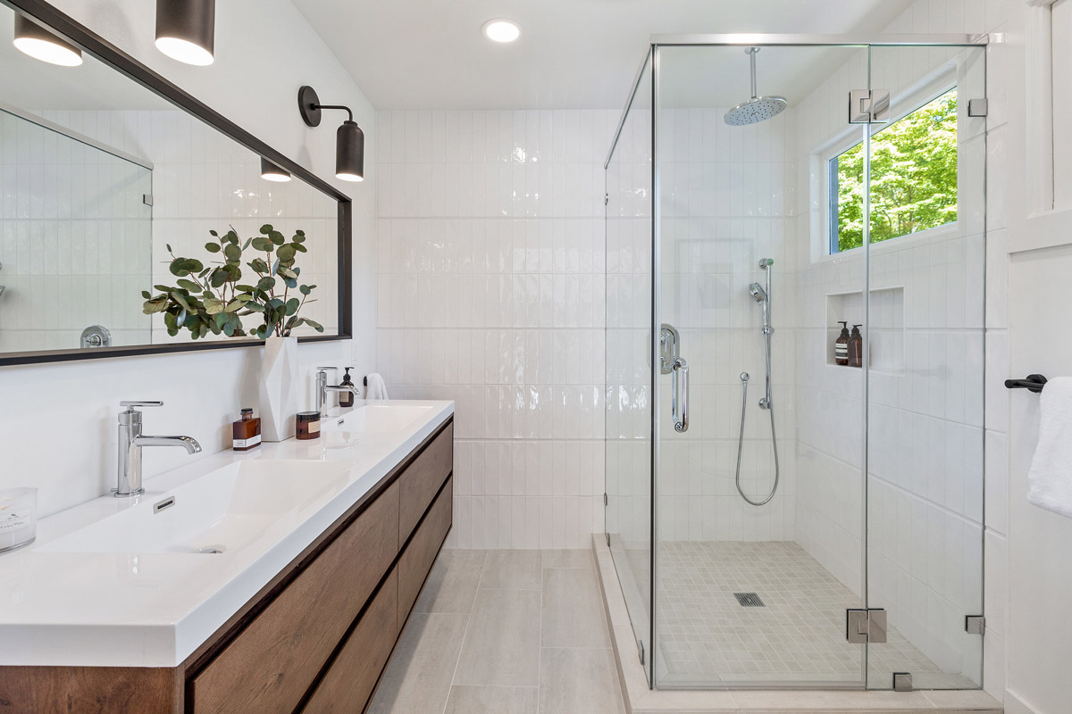 Bathroom with double vanity and glass shower