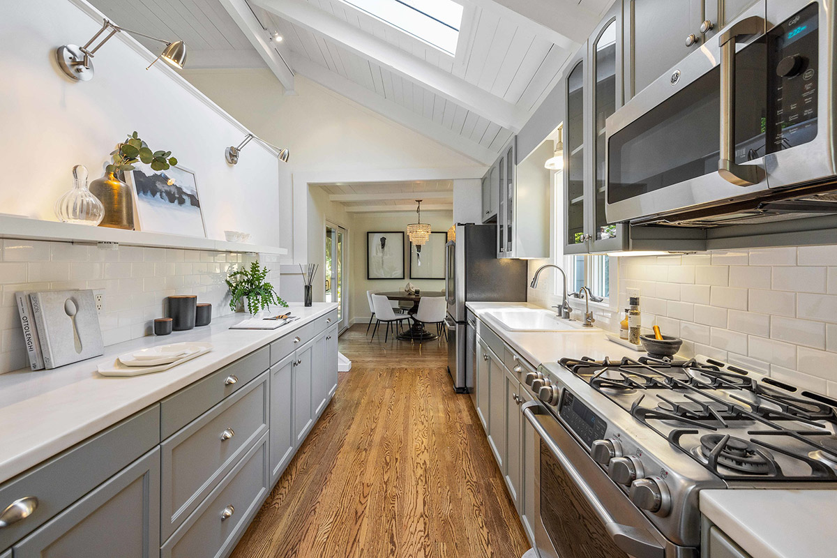 Kitchen with beautifully painted cabinets and shelving